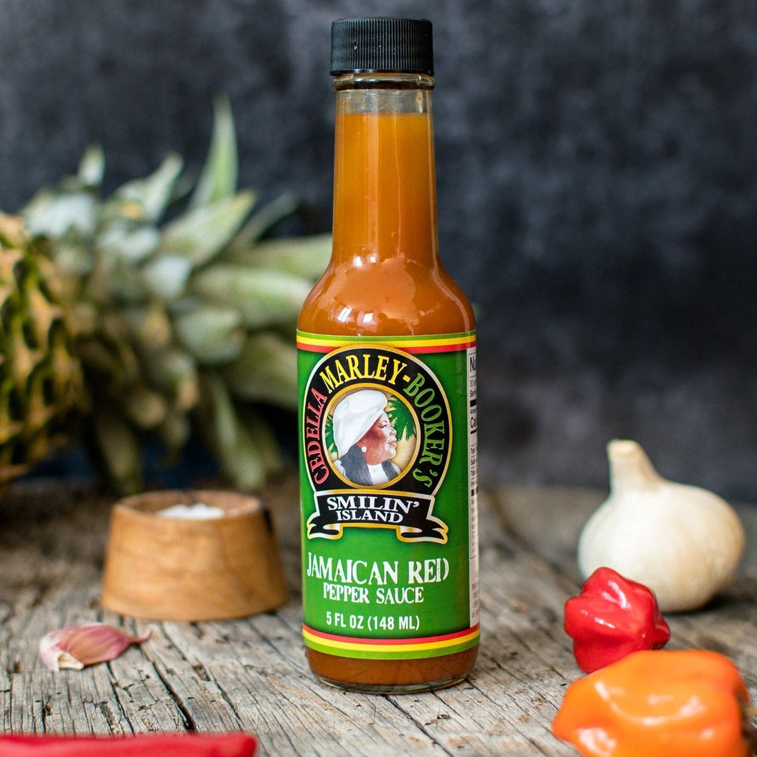 Jamaican Red Hot Sauce bottle with peppers and pineapple