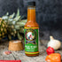 Jamaican Red Hot Sauce bottle with peppers and pineapple
